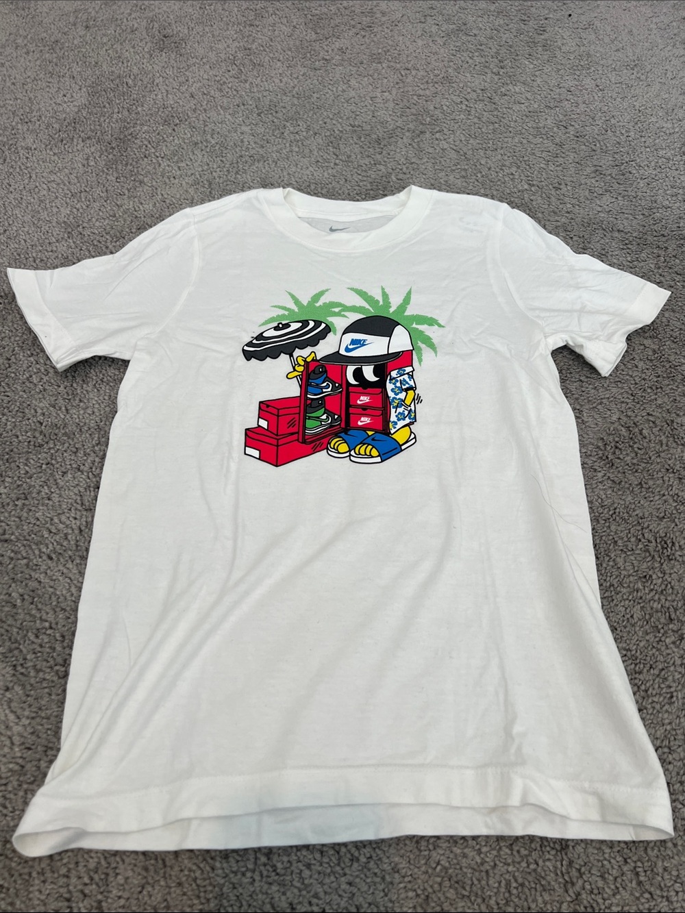 Nike White Graphic Tee with Red, Green, Blue and Yellow Cartoon Print